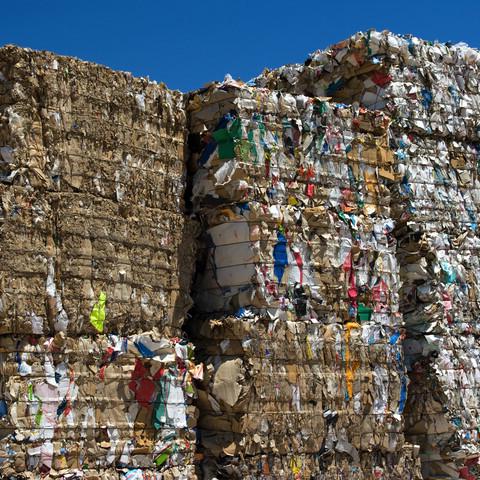 Bales of cardboard and paper ready to be recycled.